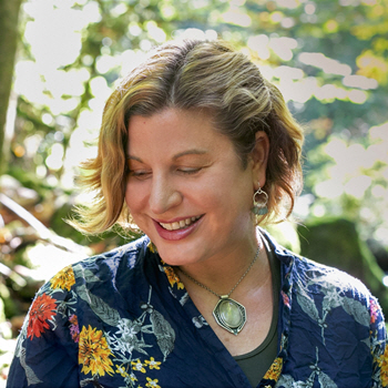 Teresa Zahariades outdoors among the trees